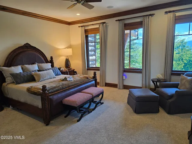 a bedroom with bed and window