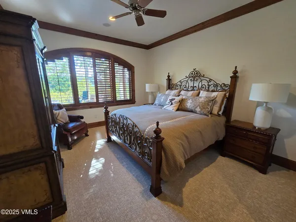 a bedroom with a bed and window