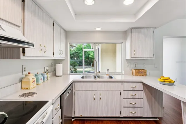 a dining room with furniture and chandelier