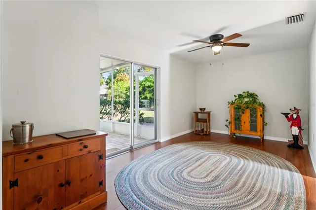 a view of a livingroom with furniture and a wooden floor