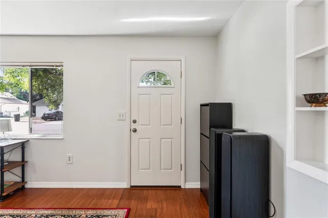 a view of kitchen with furniture and refrigerator