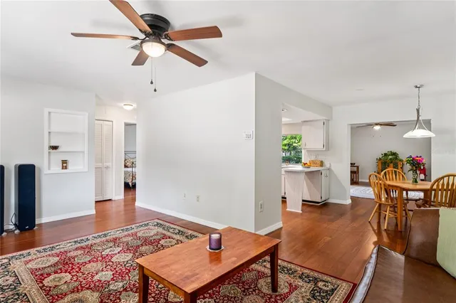 a view of a dining room with furniture window and wooden floor