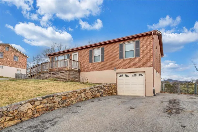 a view of a house with a snow on the road