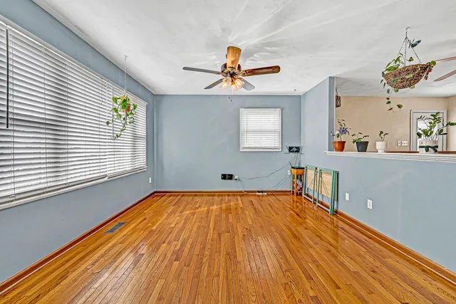a view of a room with window and wooden floor