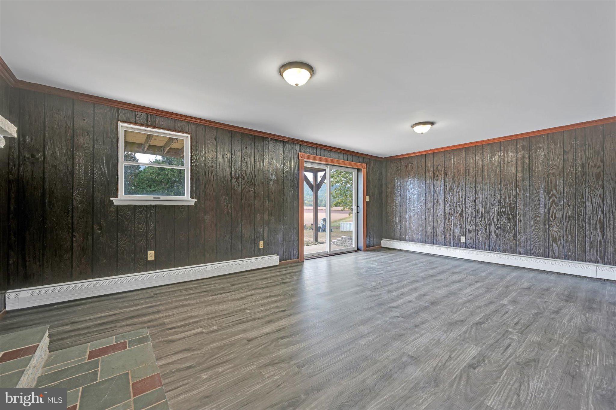301 West Walnut Street Valley View, PA 17983 - Photo 26 of 40 a view of an empty room with wooden floor and a window