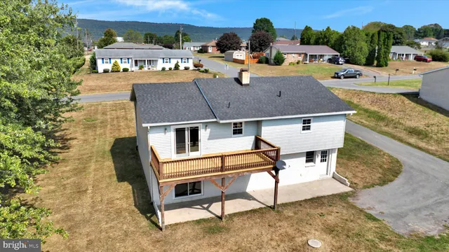 a aerial view of a house with swimming pool and sitting area