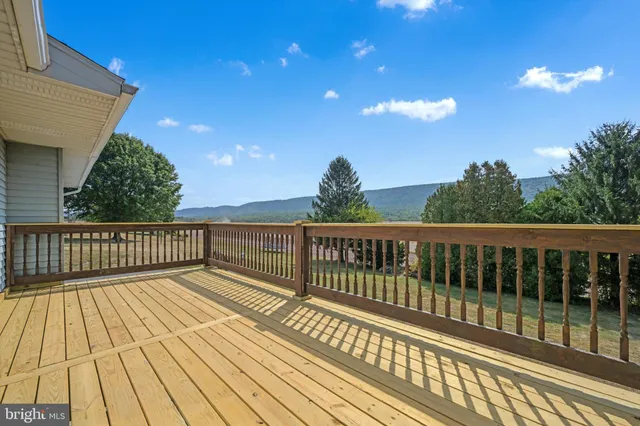 a view of balcony with wooden floor