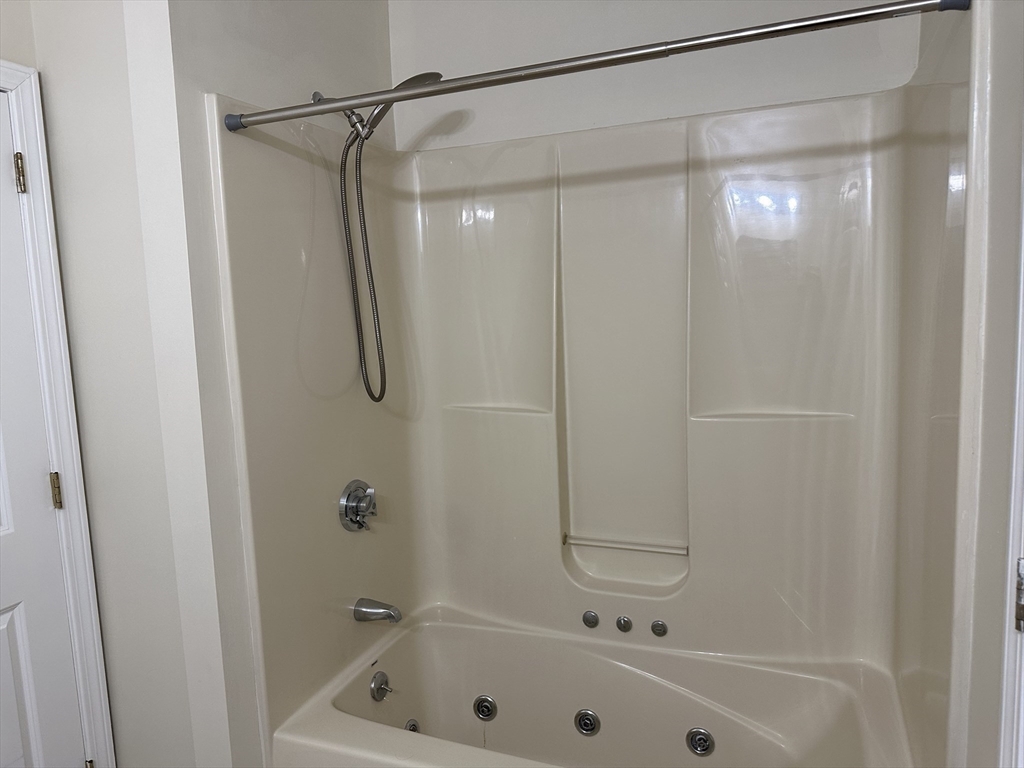 48 North Street, Unit 1 Gilbertville, MA 01031 - Photo 9 of 13 a bathroom with a shower and a bath tub