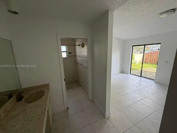 an entryway with wooden floor and door