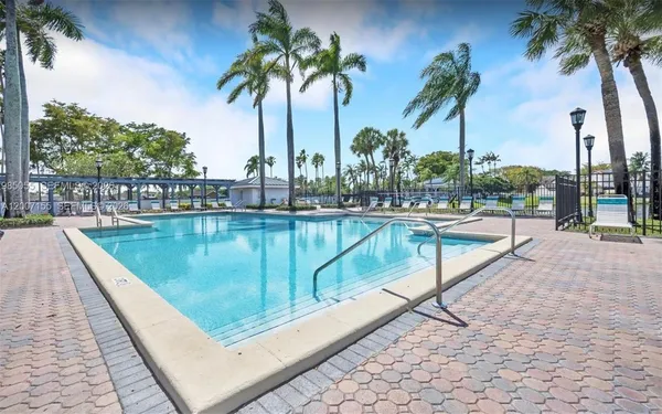a view of swimming pool with a table and chairs