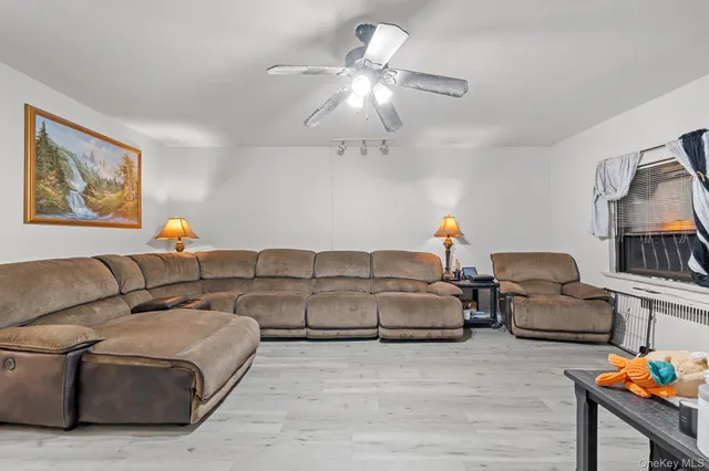 a bathroom with a mirror a toilet and a shower