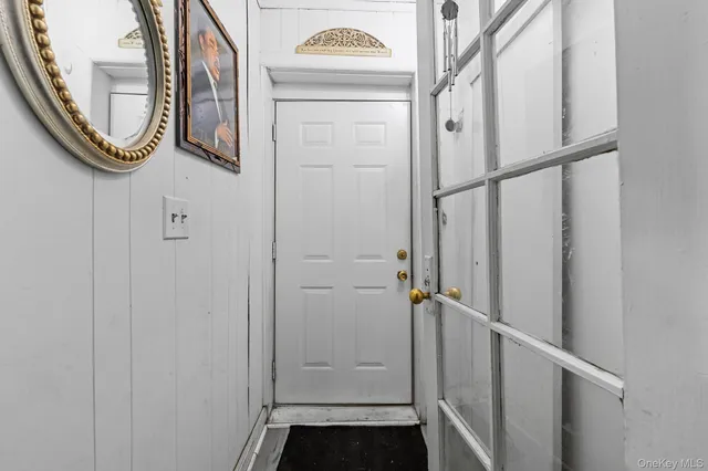 a bathroom with a granite countertop sink a toilet and a mirror