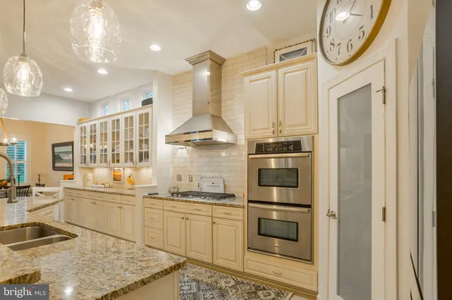a kitchen with a sink cabinets and window