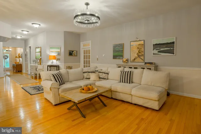 a view of a backyard with sitting area and garden
