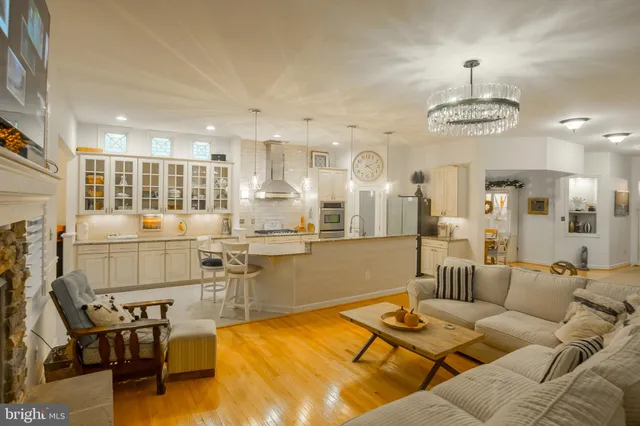 a view of a house with backyard sitting area and garden