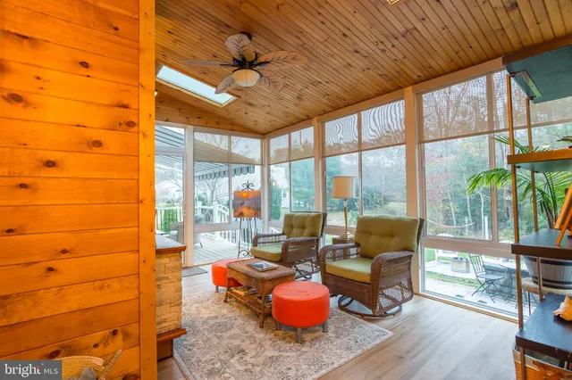 a bedroom with a bed flat screen tv and window