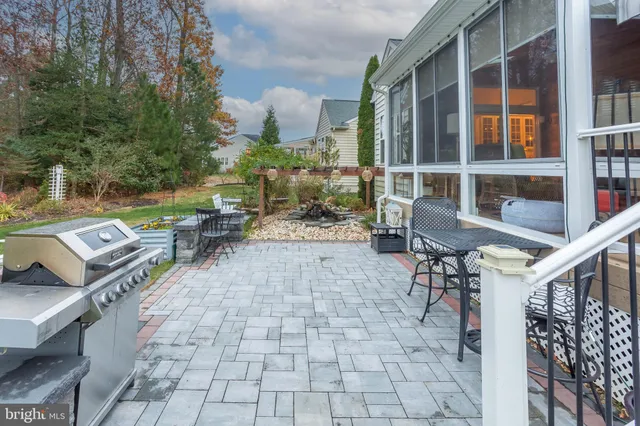 a bathroom with a granite countertop sink mirror bathtub and shower