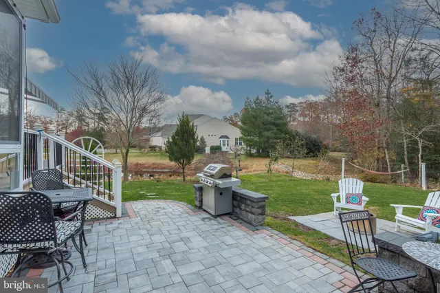 a bathroom with a bathtub a shower and a window