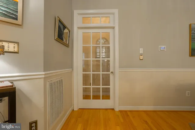 a bedroom with furniture and a large window