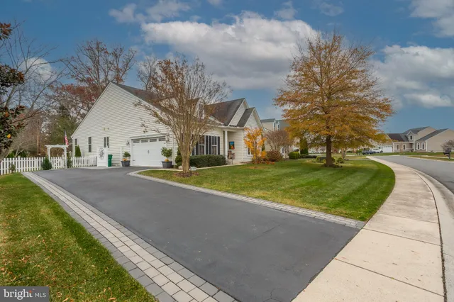 a view of yard with swimming pool and green space