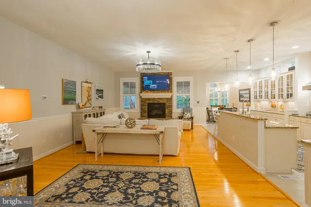 a view of a dining room with furniture and a chandelier