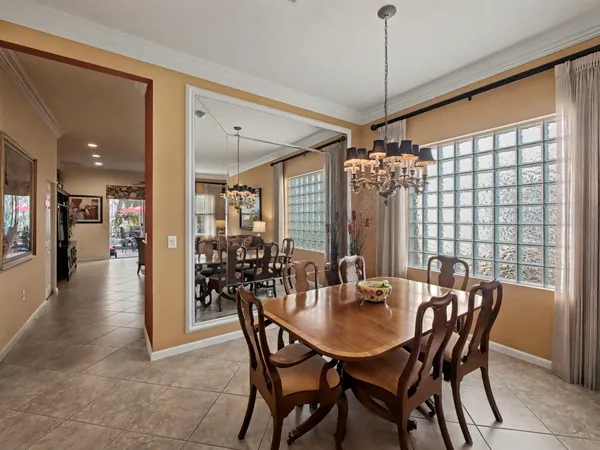 a view of a dining room with furniture and window
