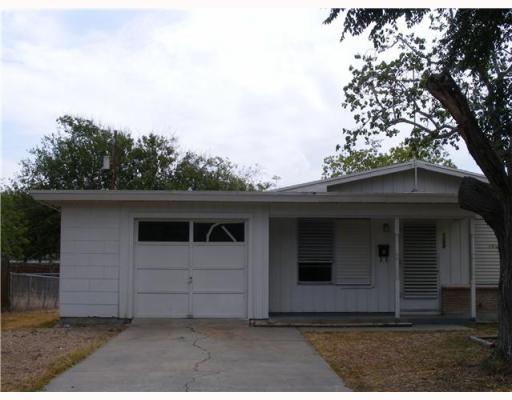 a front view of a house with a garage