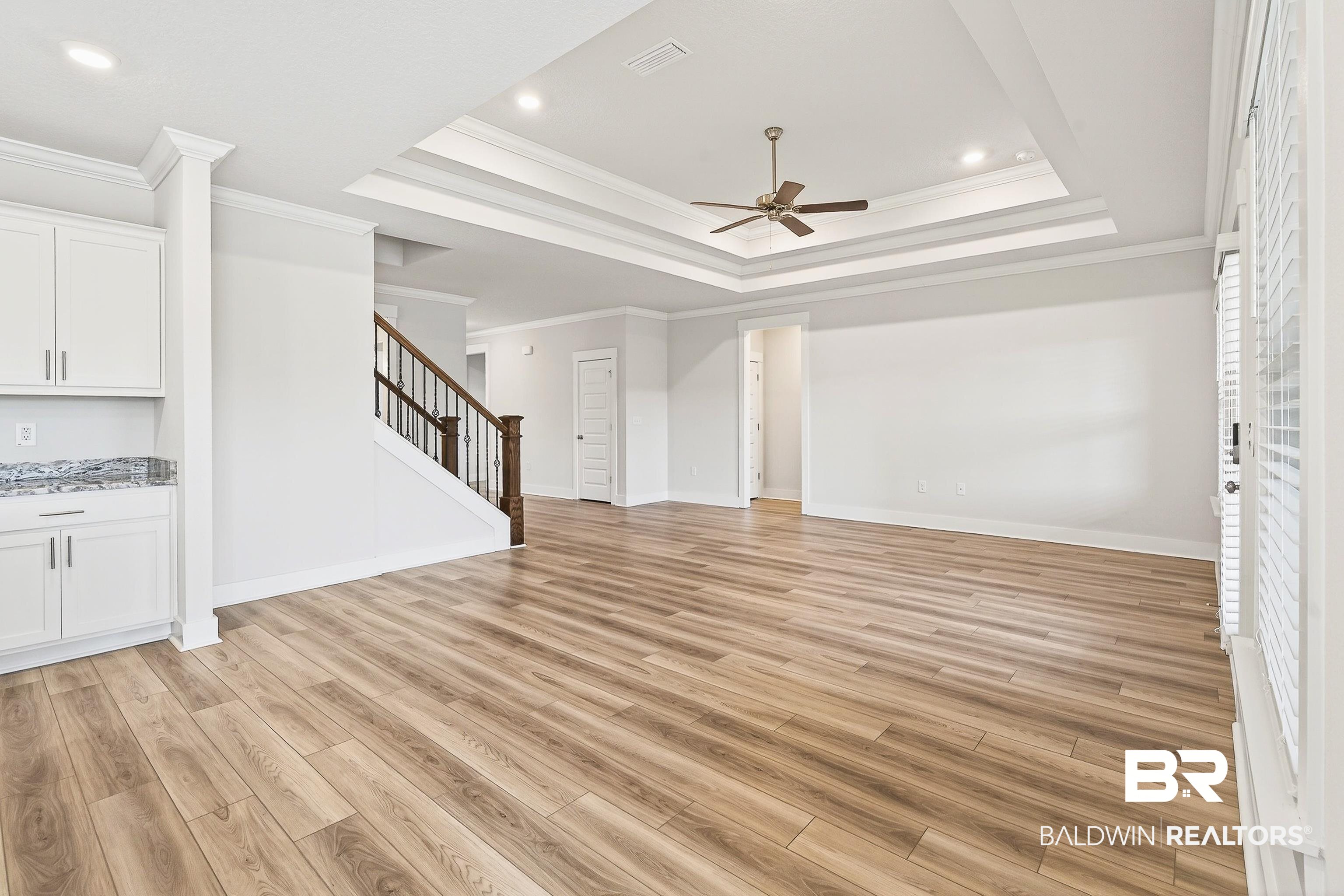 1728 Partridge Street Foley, AL 36535 - Photo 16 of 37 Unfurnished living room with ceiling fan, light wood-style floors, ornamental molding, and recessed lighting