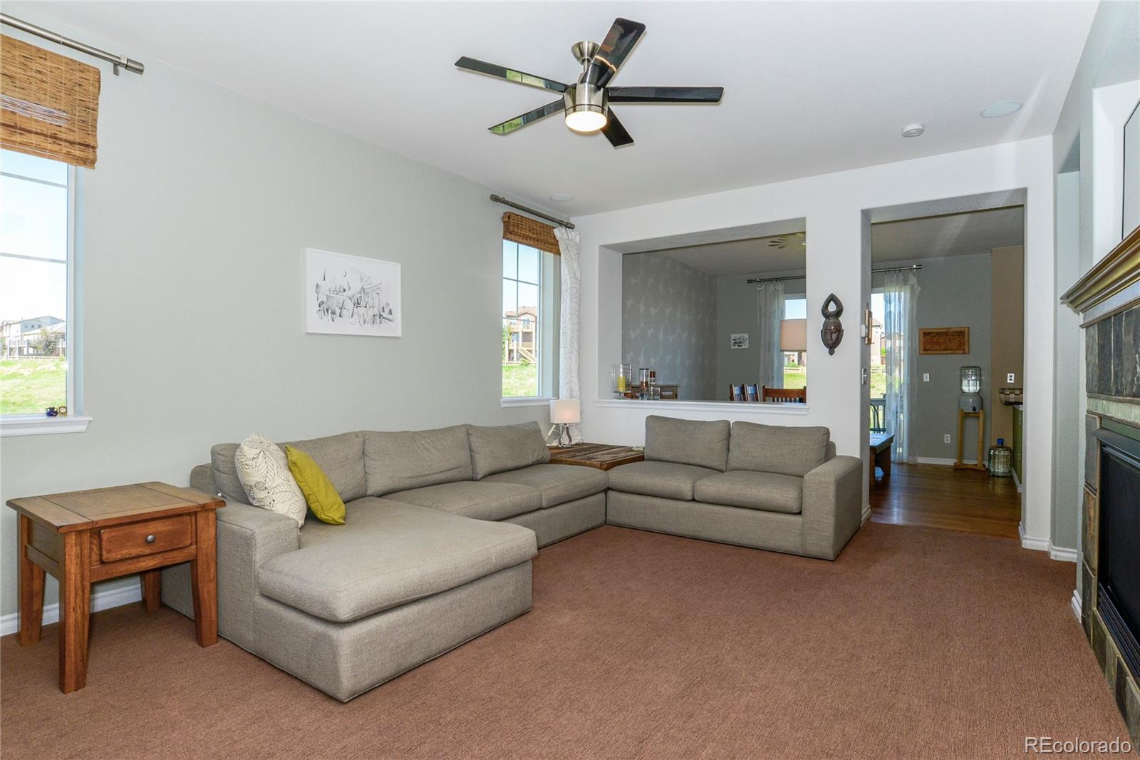 10926 Towerbridge Road Highlands Ranch, CO 80130 - Photo 3 of 34 a living room with furniture and a large window