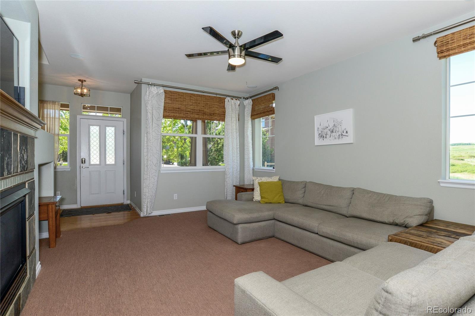 10926 Towerbridge Road Highlands Ranch, CO 80130 - Photo 5 of 34 a living room with furniture and a window