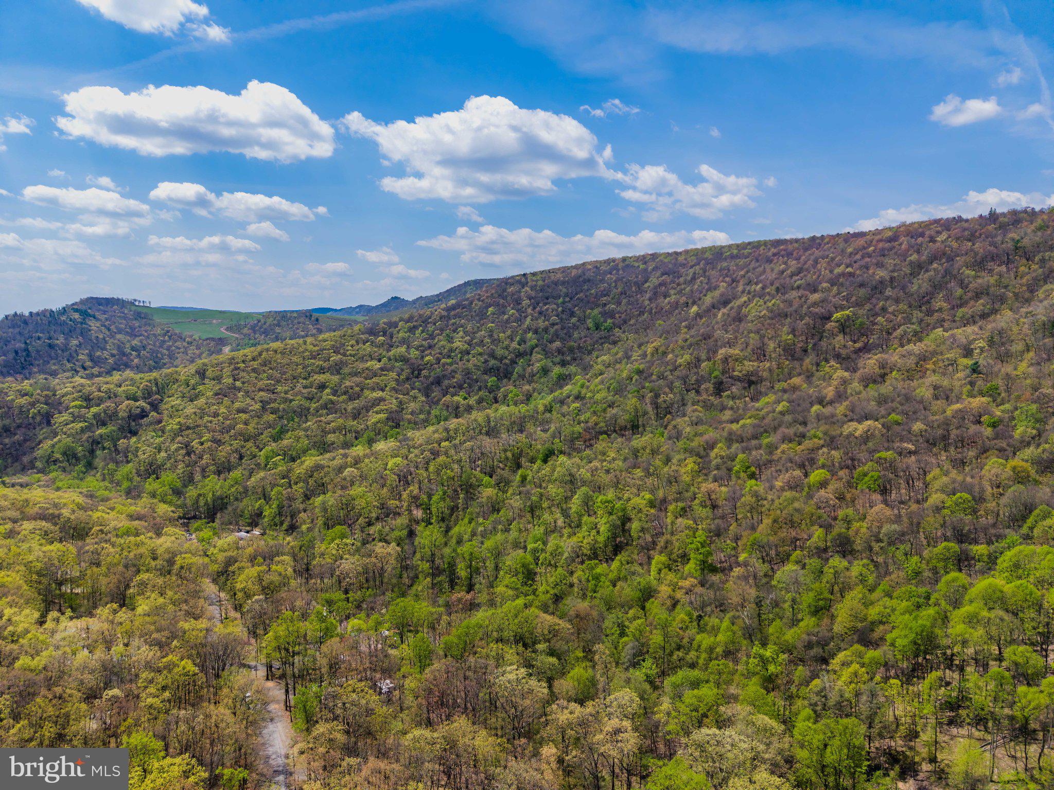 0 Gilbert Road Chambersburg, PA 17202 - Photo 7 of 10 Lush hills under a vibrant sky.
