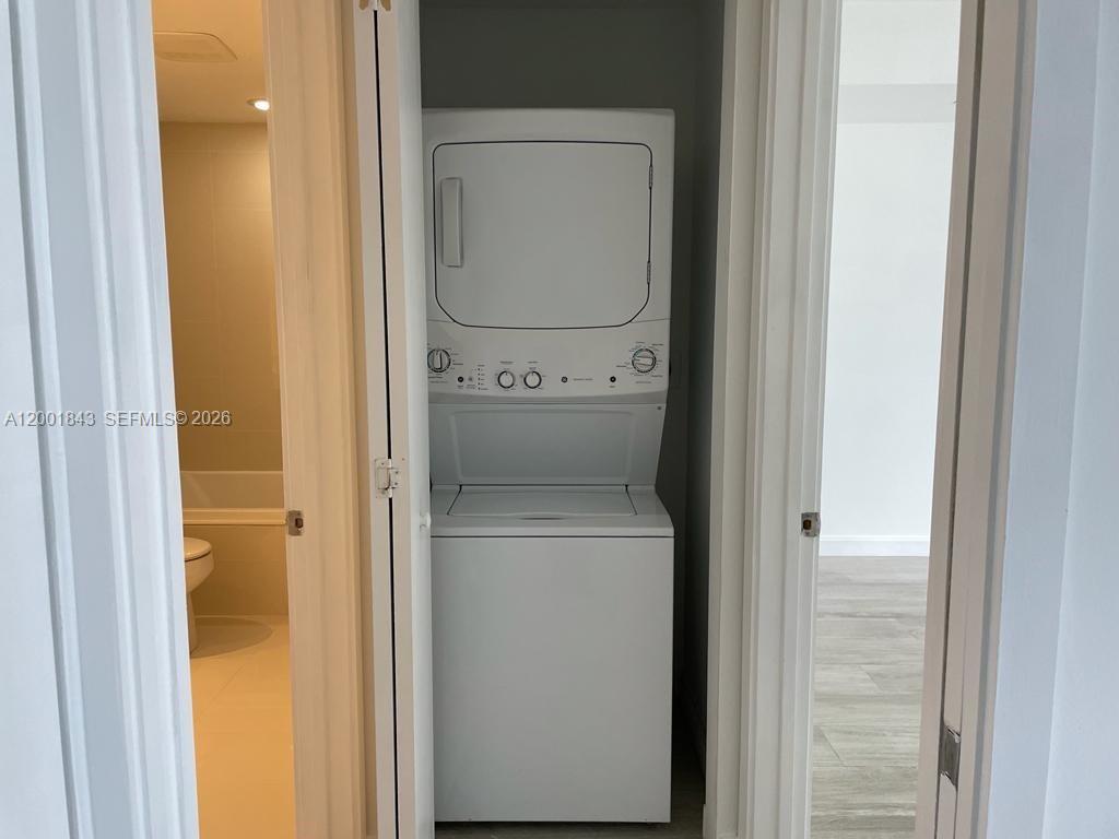 55 Southwest 9th Street, Unit 3102 Miami, FL 33130 - Photo 7 of 13 a utility room with dryer and washer