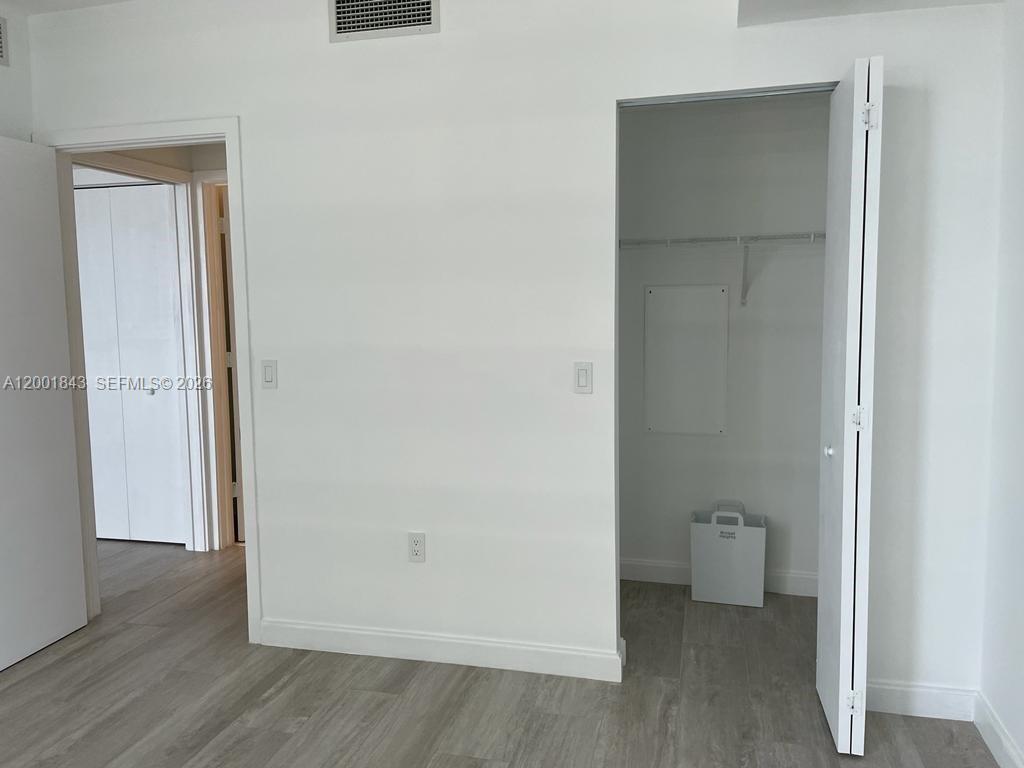 55 Southwest 9th Street, Unit 3102 Miami, FL 33130 - Photo 10 of 13 a bathroom with a toilet