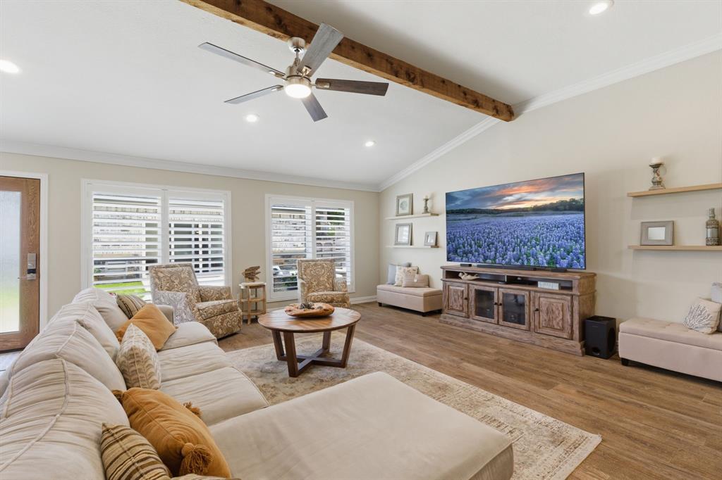 10390 Ridgecrest Street Frisco, TX 75033 - Photo 14 of 40 a living room with furniture a fireplace and a flat screen tv