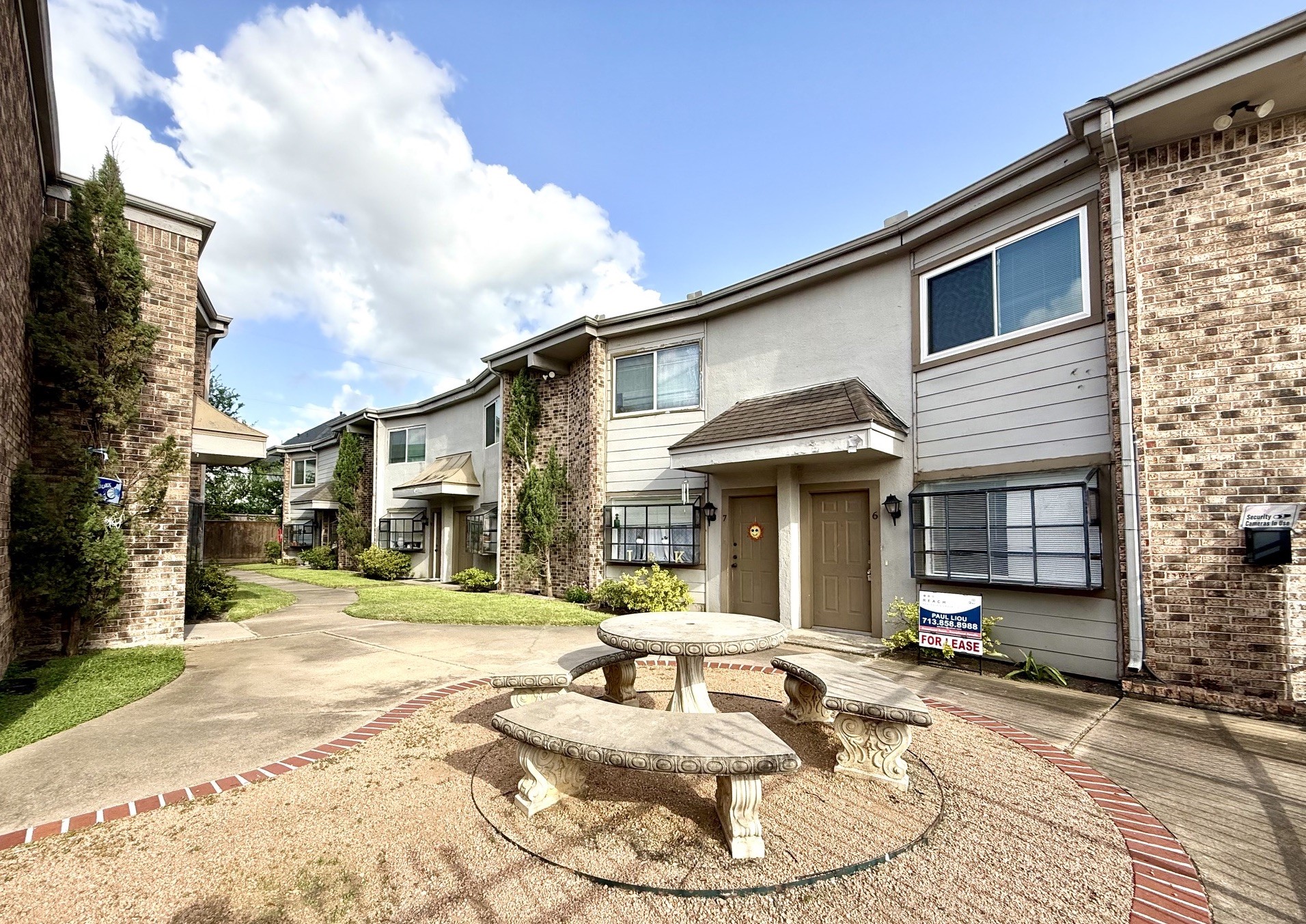 1518 Wirt Road, Unit 6 Houston, TX 77055 - Photo 1 of 14 a view of a white house with a patio