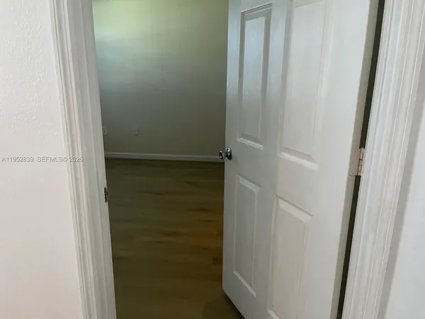 a view of a room has a window