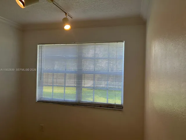 a view of a hallway with closet