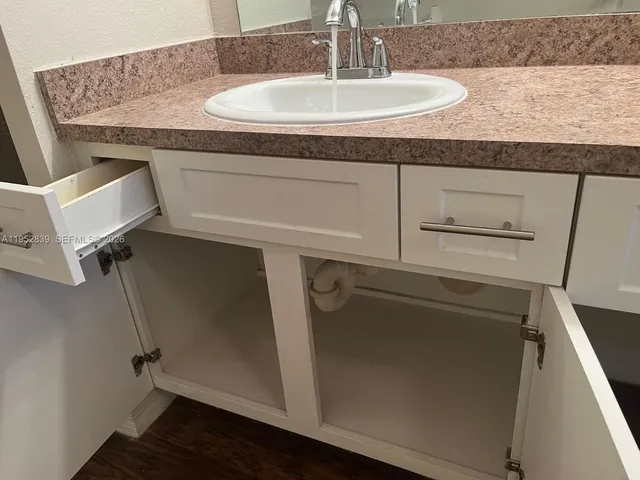 a view of a room with wooden floor and a porch