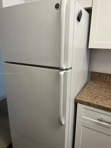 a bathroom with a sink a mirror and a shower