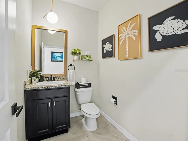 a living room with furniture a book shelf and a window