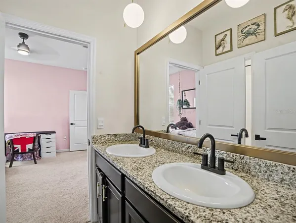 a bathroom with a toilet a sink and shower