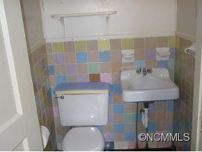 282 Phillipsville Loop Canton, NC 28716 - Photo 14 of 19 a bathroom with a sink a toilet and shower