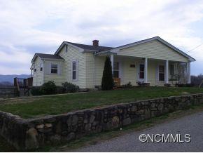 282 Phillipsville Loop Canton, NC 28716 - Photo 18 of 19 a front view of a house with a garden