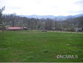282 Phillipsville Loop Canton, NC 28716 - Photo 4 of 19 a view of an house with backyard space and garden