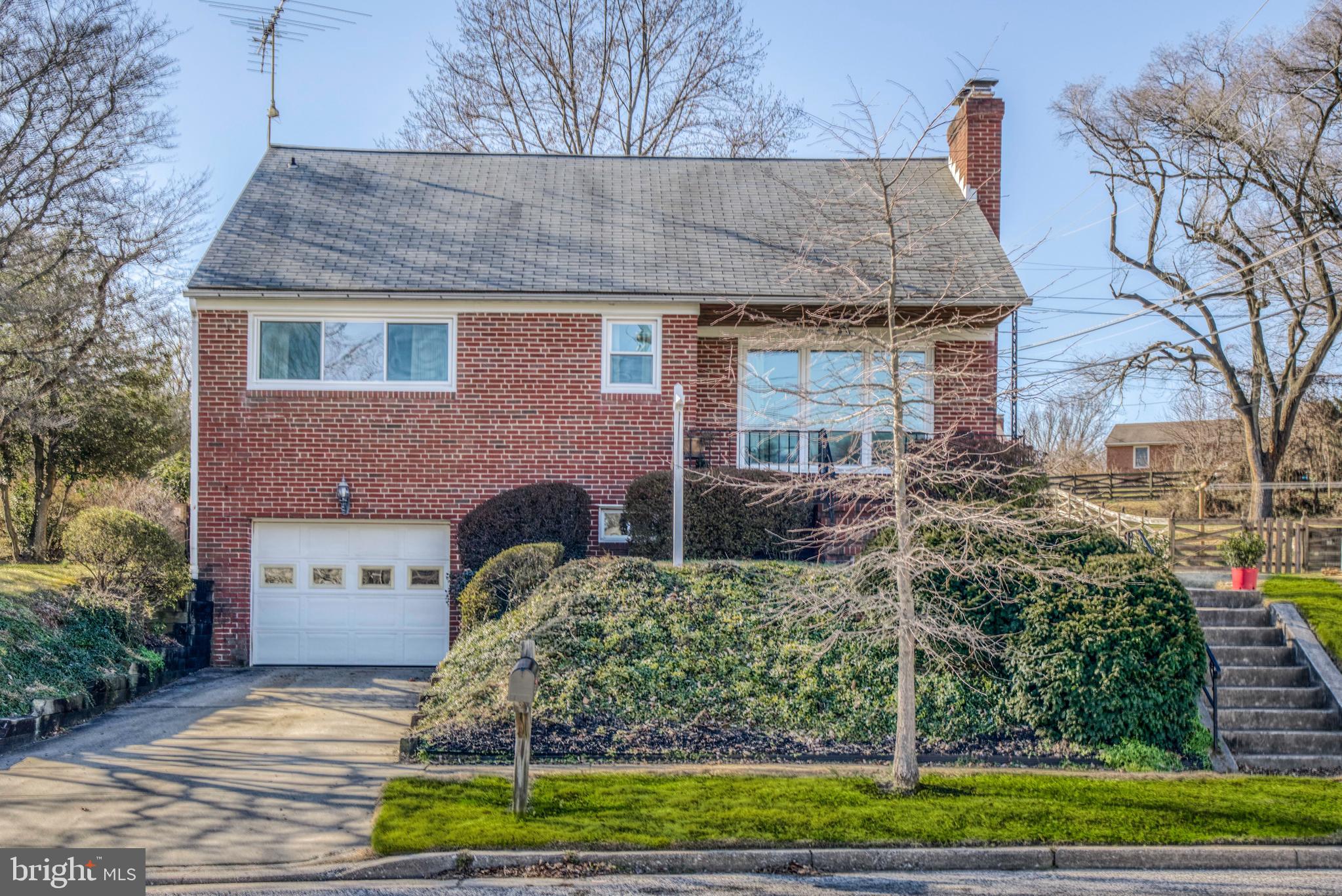 1305 Glendale Road Baltimore, MD 21239 - Photo 4 of 49 front view of a house with a yard