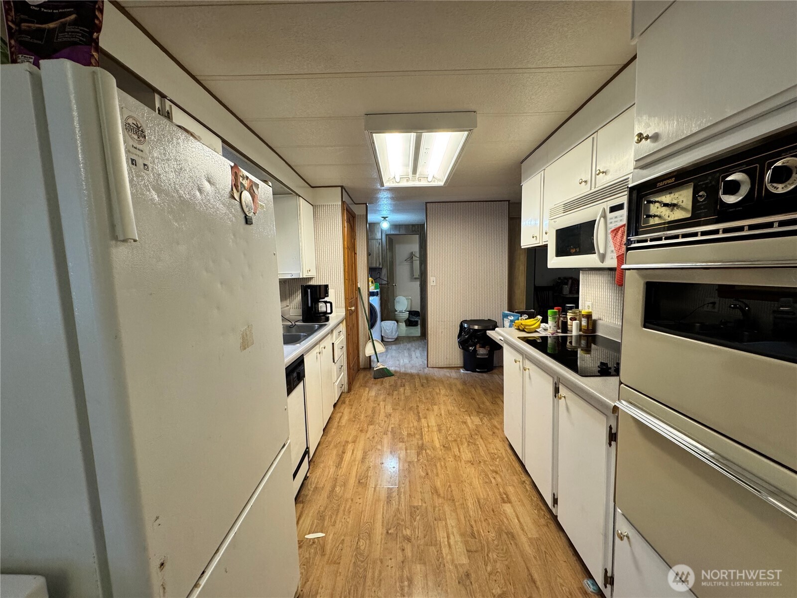 5600 Mt Solo Road, Unit 162 Longview, WA 98632 - Photo 12 of 20 a kitchen with stainless steel appliances a refrigerator a stove and a sink