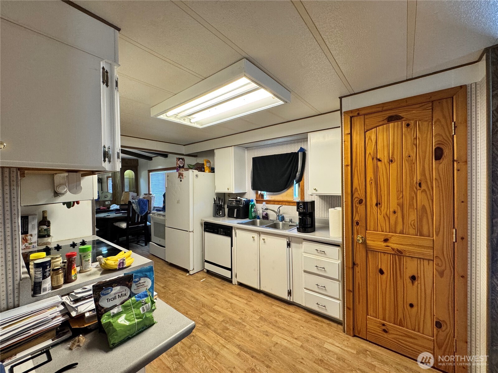 5600 Mt Solo Road, Unit 162 Longview, WA 98632 - Photo 13 of 20 a kitchen with stainless steel appliances a stove top oven and cabinets