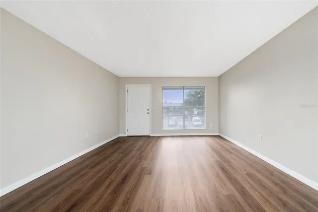 a view of kitchen space with wooden floor
