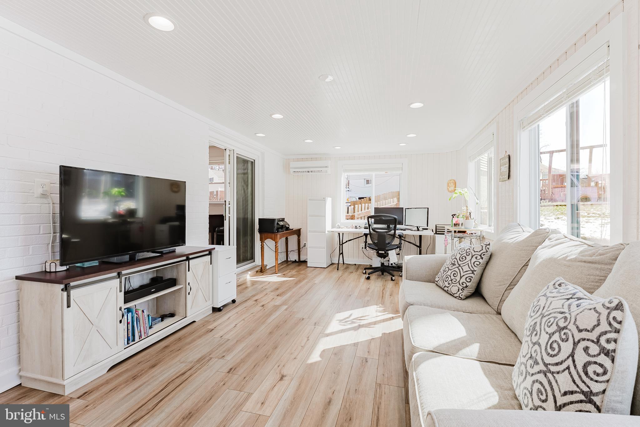 5937 Atteentee Road Springfield, VA 22150 - Photo 11 of 44 a living room with furniture and a flat screen tv