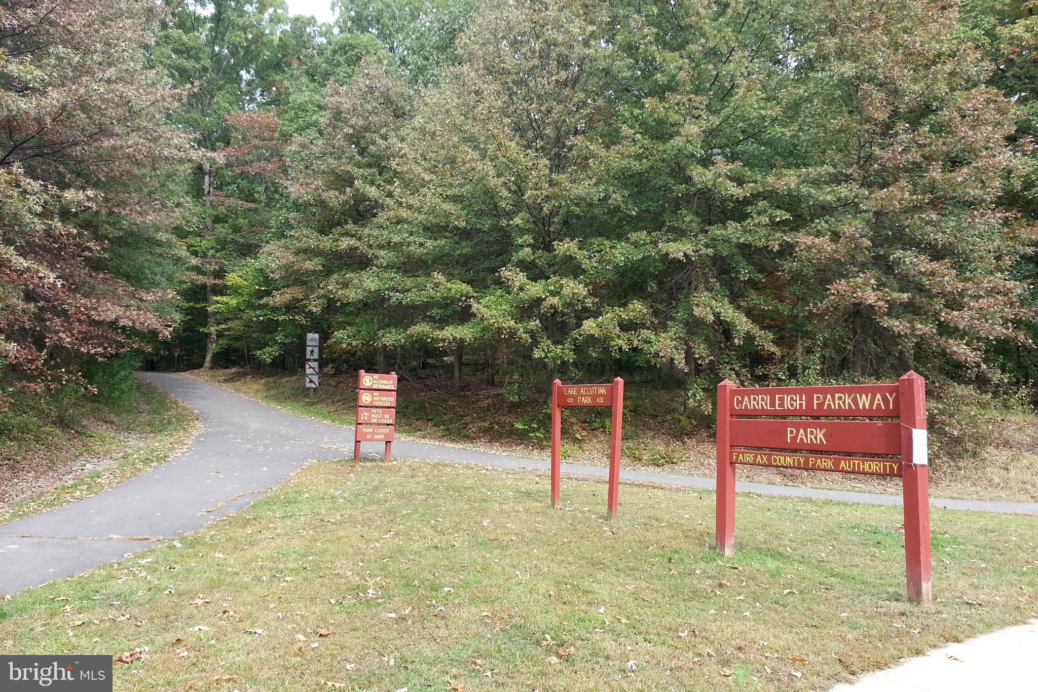 5937 Atteentee Road Springfield, VA 22150 - Photo 13 of 44 a backyard of a house with chairs and wooden fence